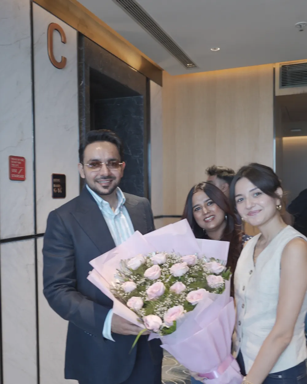 Amrit Deol being welcomed with a bouquet before a recording